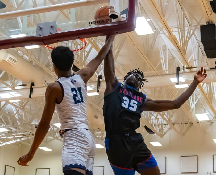 Westlake center Wonder Kahozi (35) blocks a dunk attempt by Fort Bend Clements Rangers' Rahman Olajuwon (21) during the William Roberts Memorial Tournament on Dec 30.